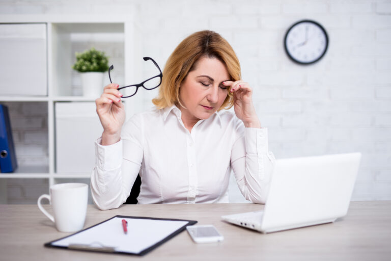 Woman stressed out at the office