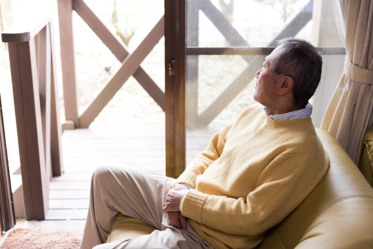 Depressed Man Looking Out Window